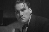 Case Of The Curious Bride, The (1935) -- Gregory Moxley (Errol Flynn)